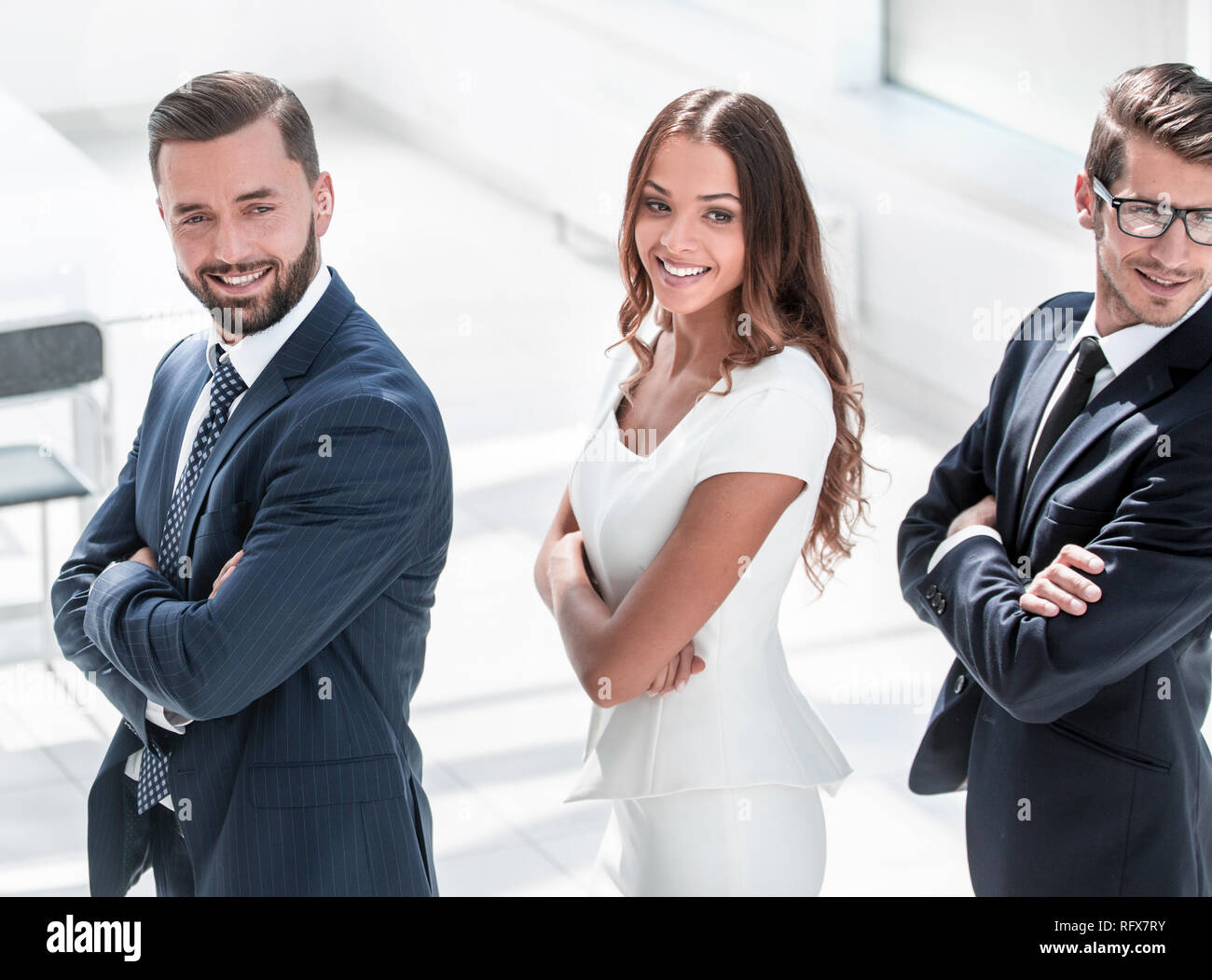 side view. successful business people standing together Stock Photo - Alamy