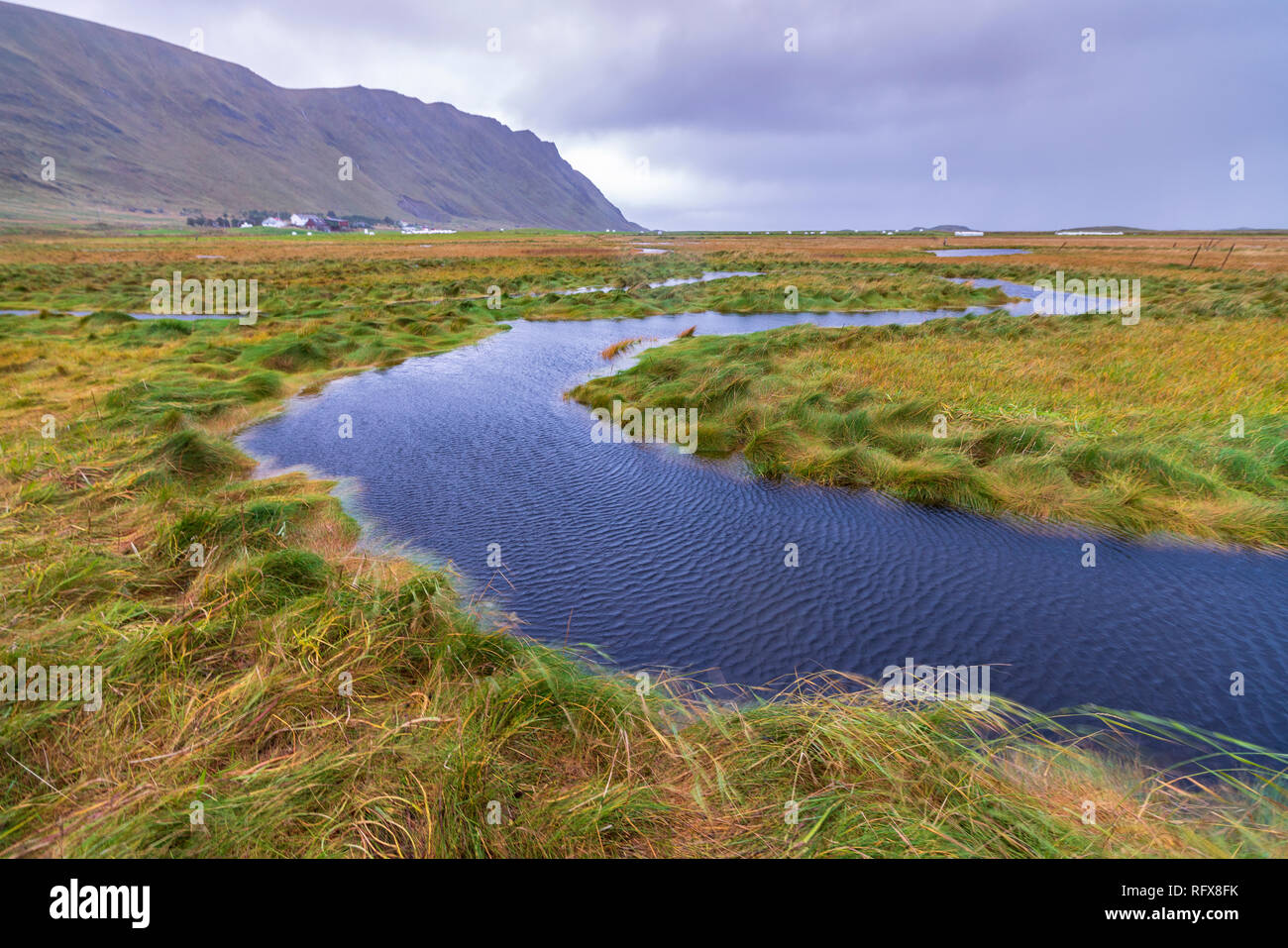Flowing water of winding creek, Fredvang, Nordland county, Lofoten Islands, Norway, Europe Stock Photo