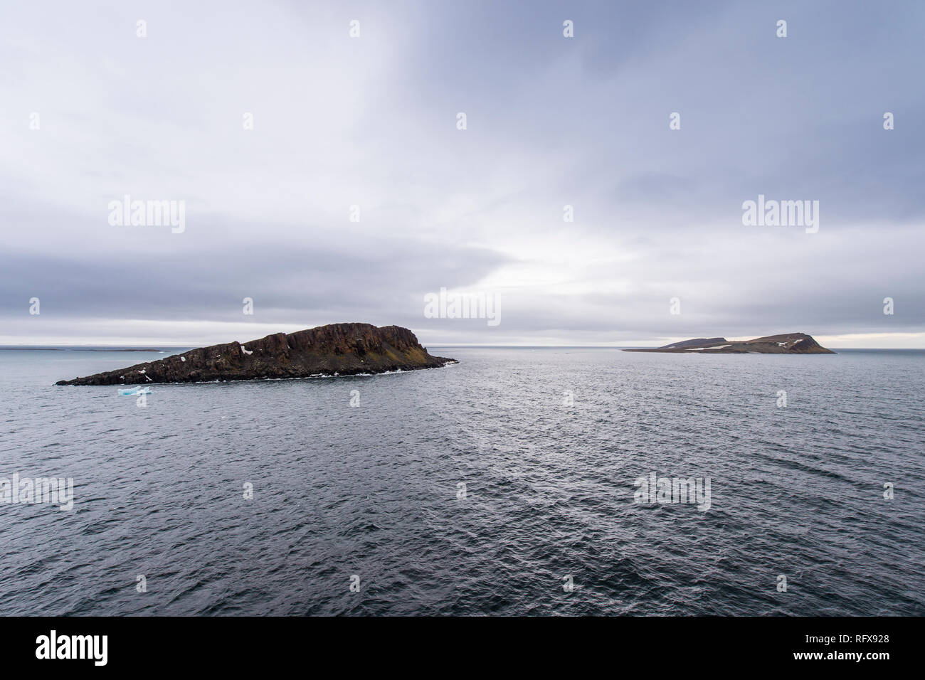 Moody lights over Cape Trieste, Franz Josef Land archipelago, Arkhangelsk Oblast, Arctic, Russia, Europe Stock Photo