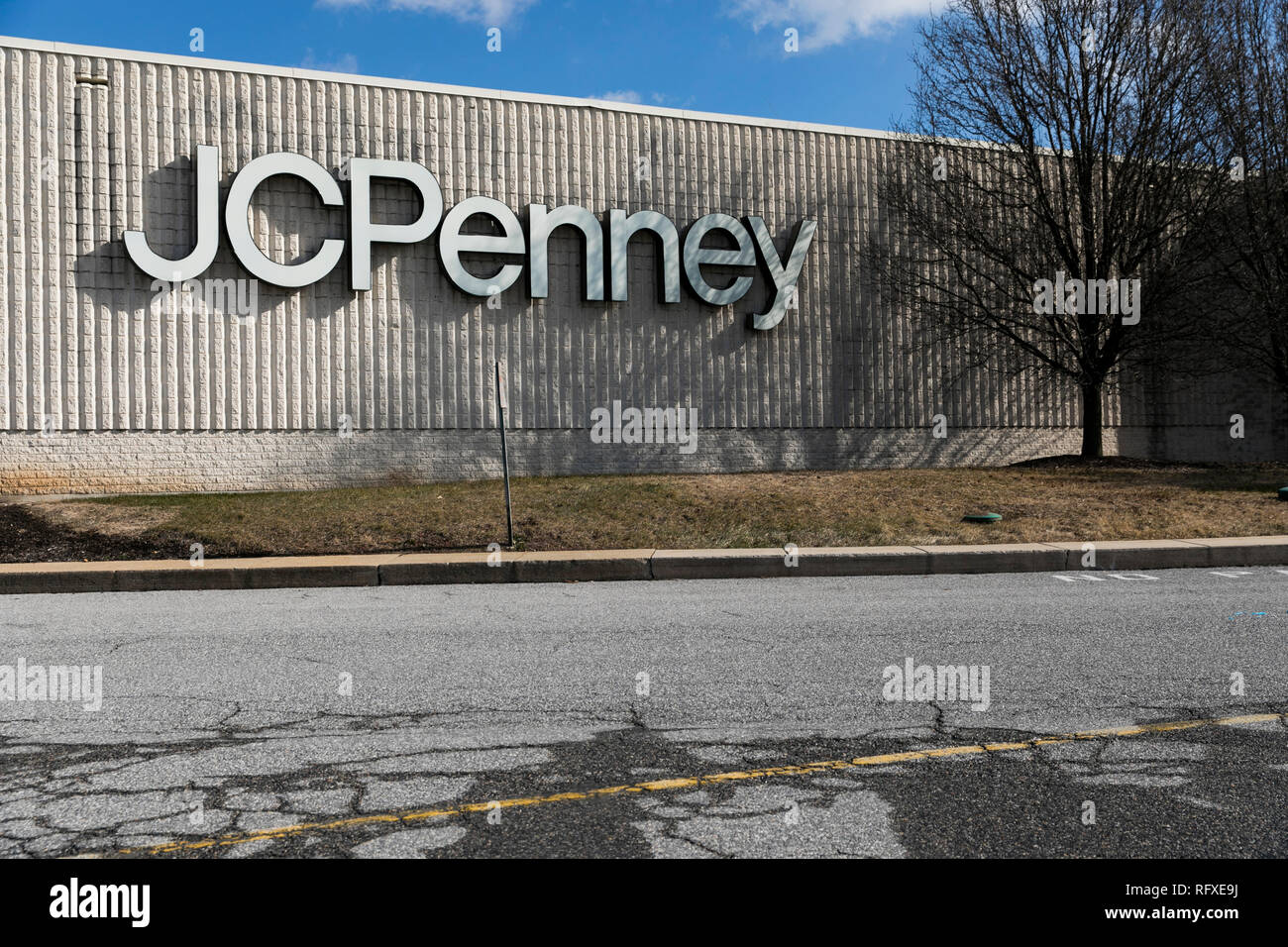 A logo sign outside of an abandoned JCPenney retail store location in