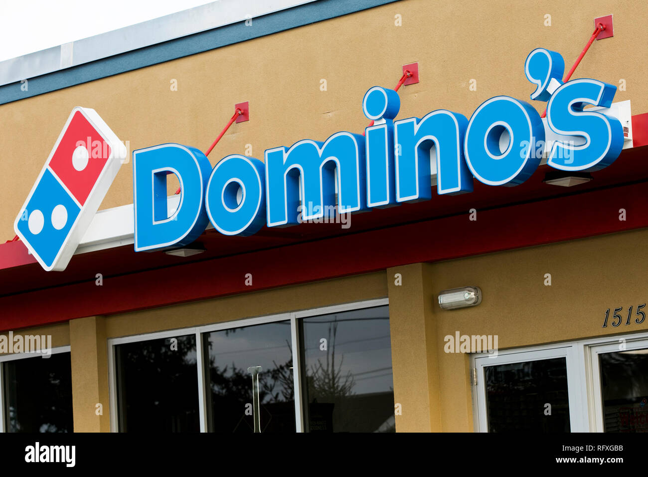 A Logo Sign Outside Of A Domino S Pizza Restaurant Location In
