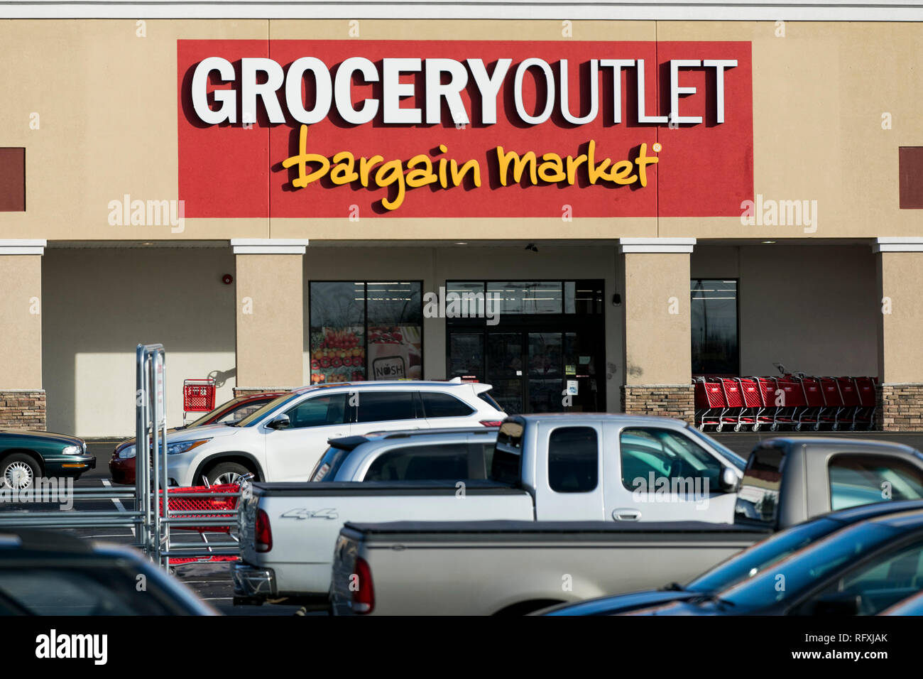 A logo sign outside of a Grocery Outlet retail grocery store location