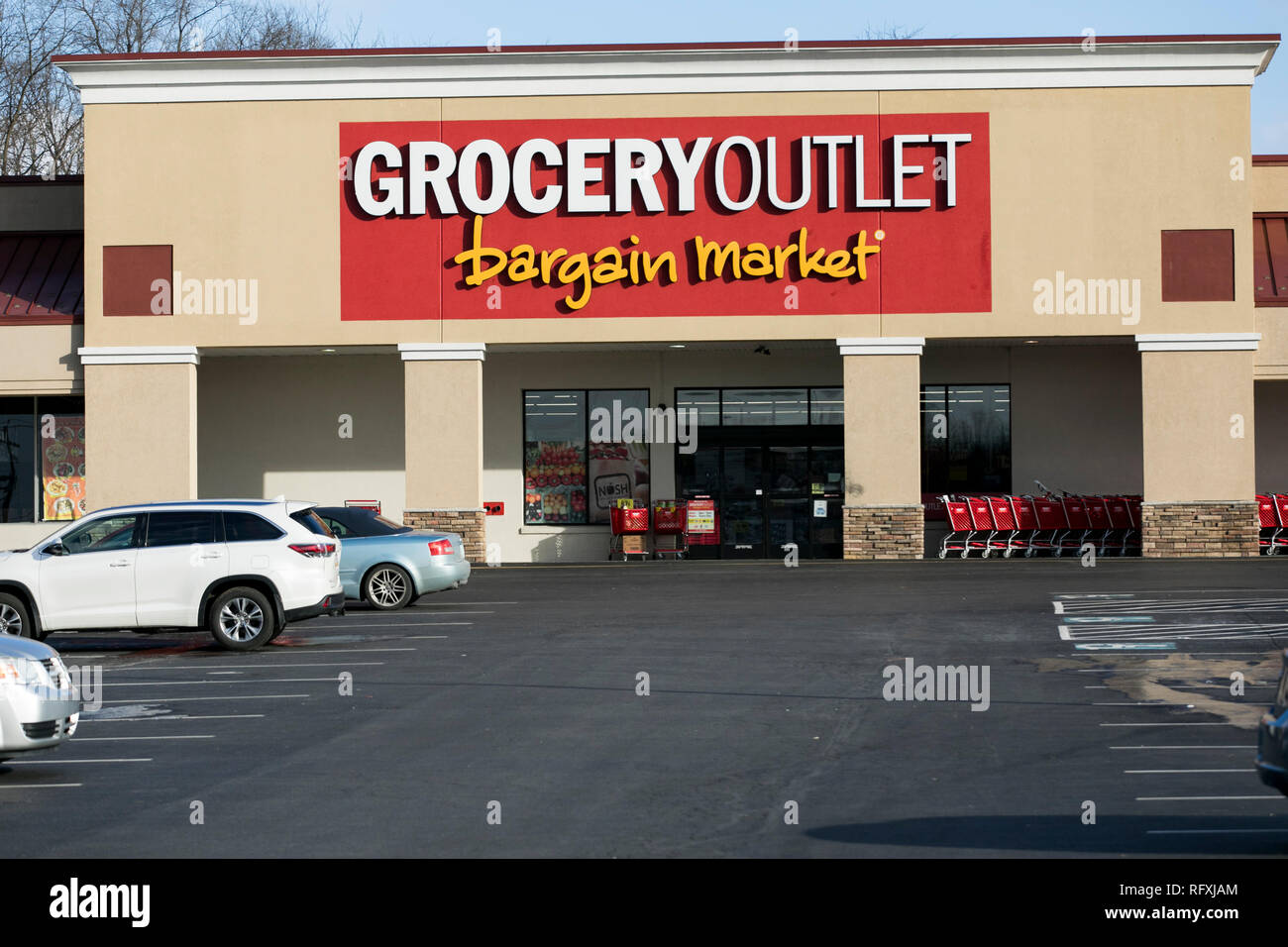 A logo sign outside of a Grocery Outlet retail grocery store location