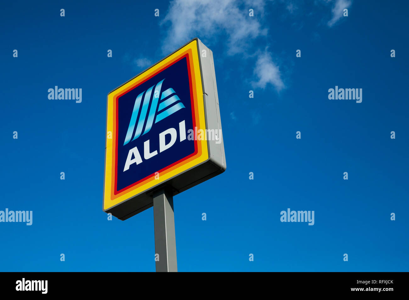 A logo sign outside of a Aldi retail grocery store location in