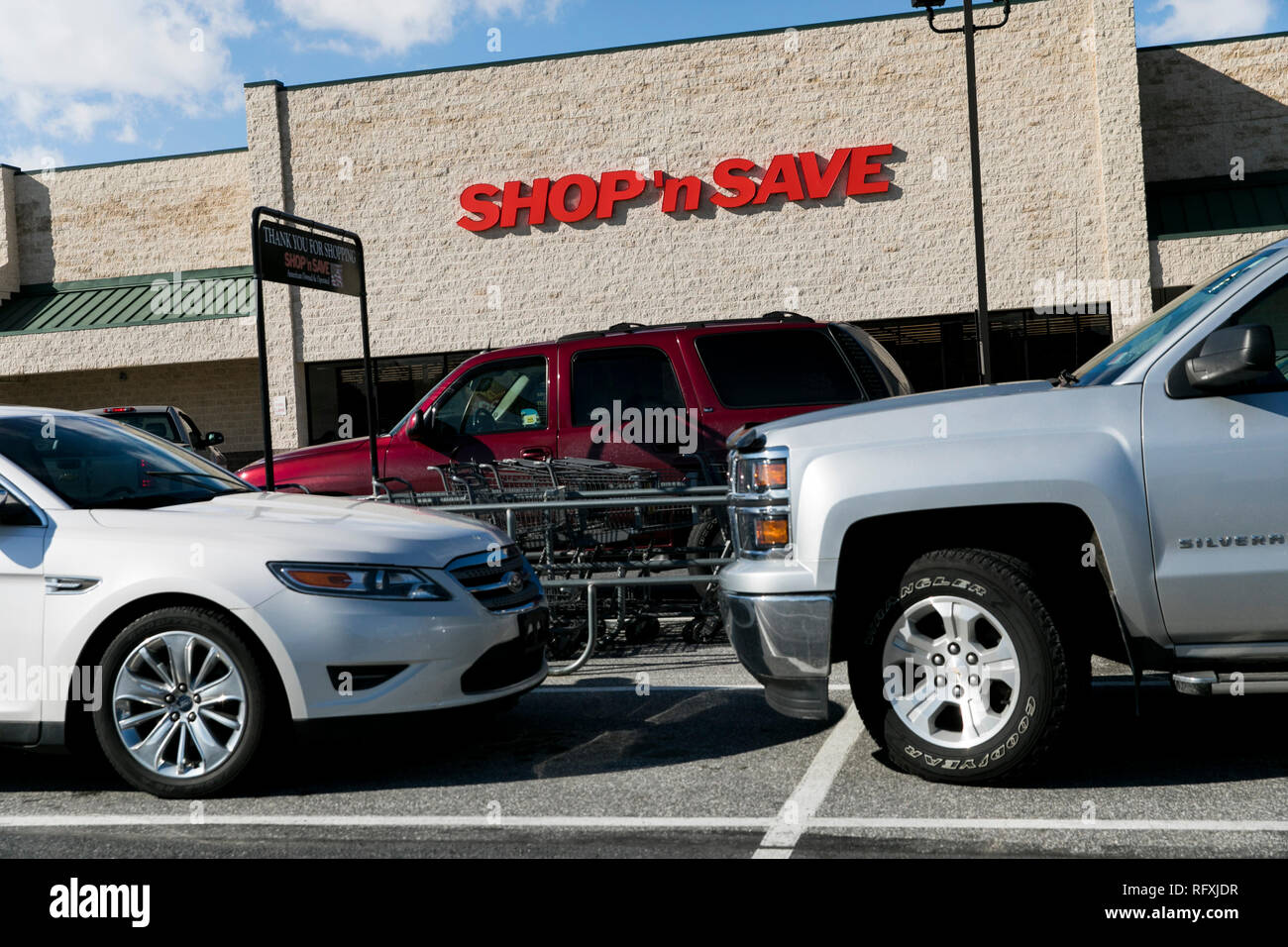 A logo sign outside of a SHOP 'n SAVE retail grocery store location in ...