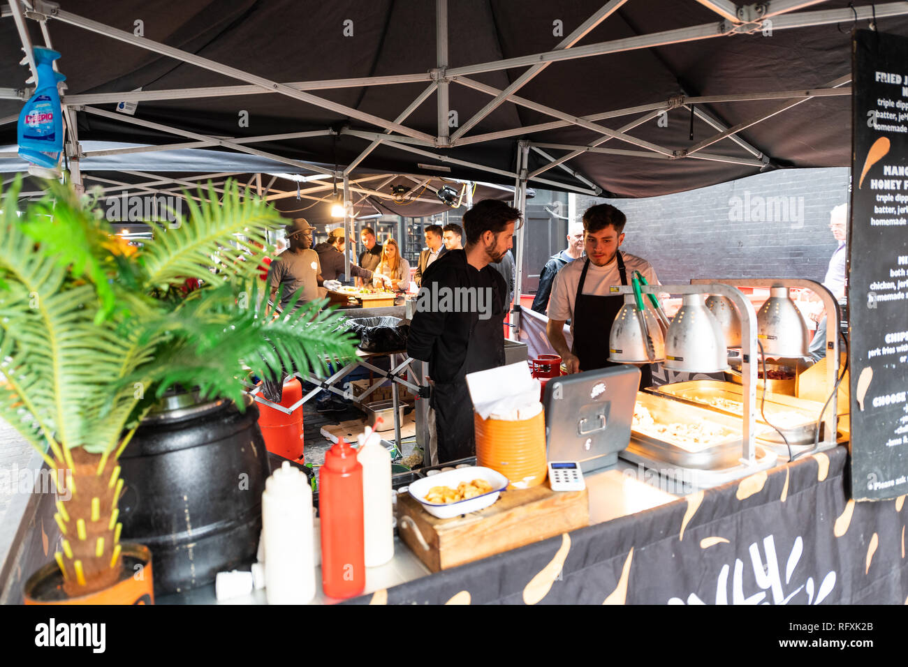 London, UK - September 12, 2018: Famous Brewer Market Street Food Union culture in Soho and people preparing fast food Stock Photo