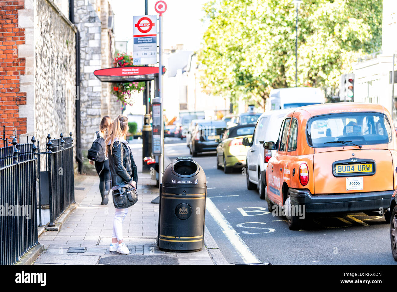 Bus stop uk london woman waiting hi-res stock photography and images ...