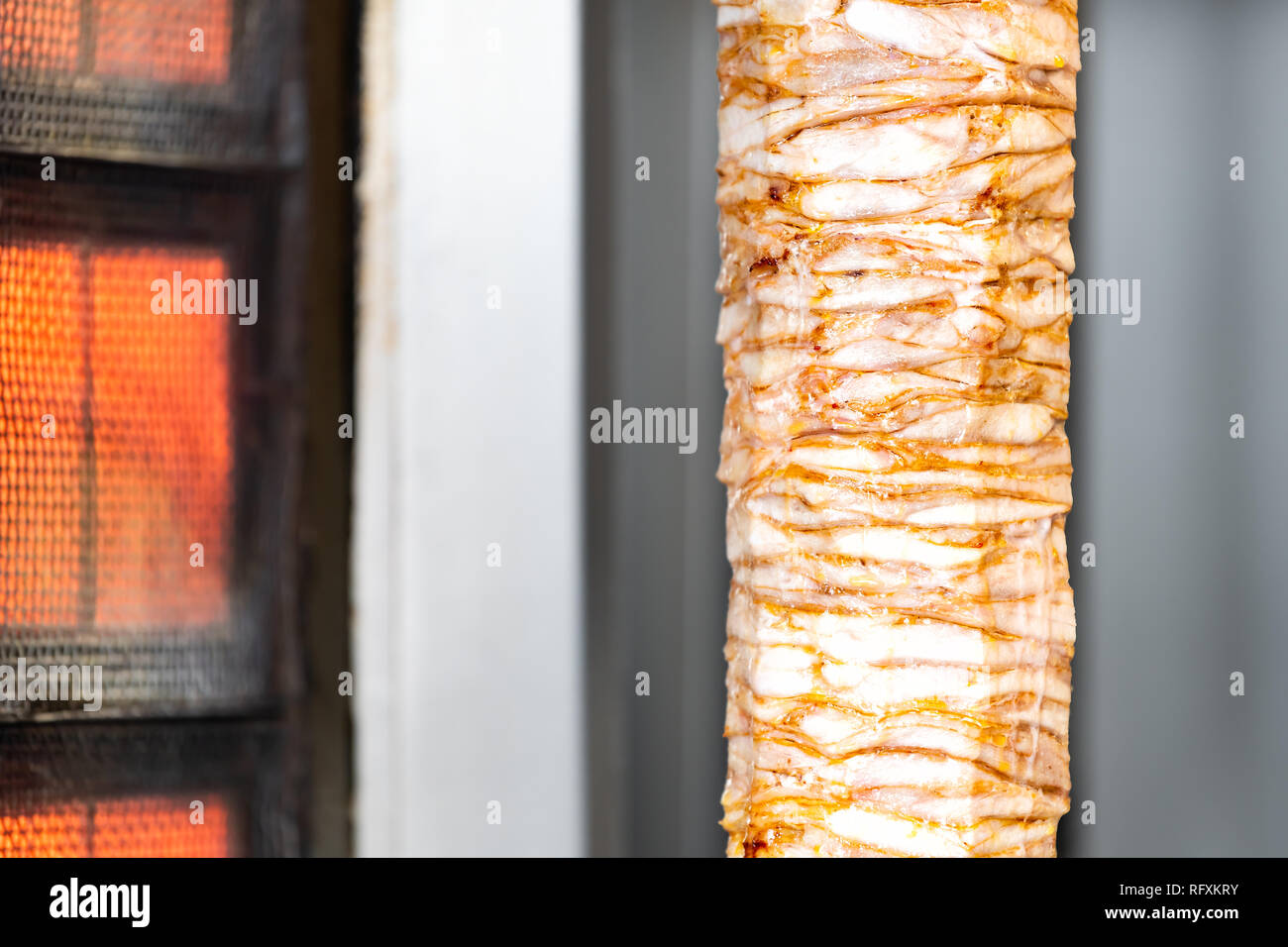 Meat carving grilled kebab closeup in building restaurant with fat