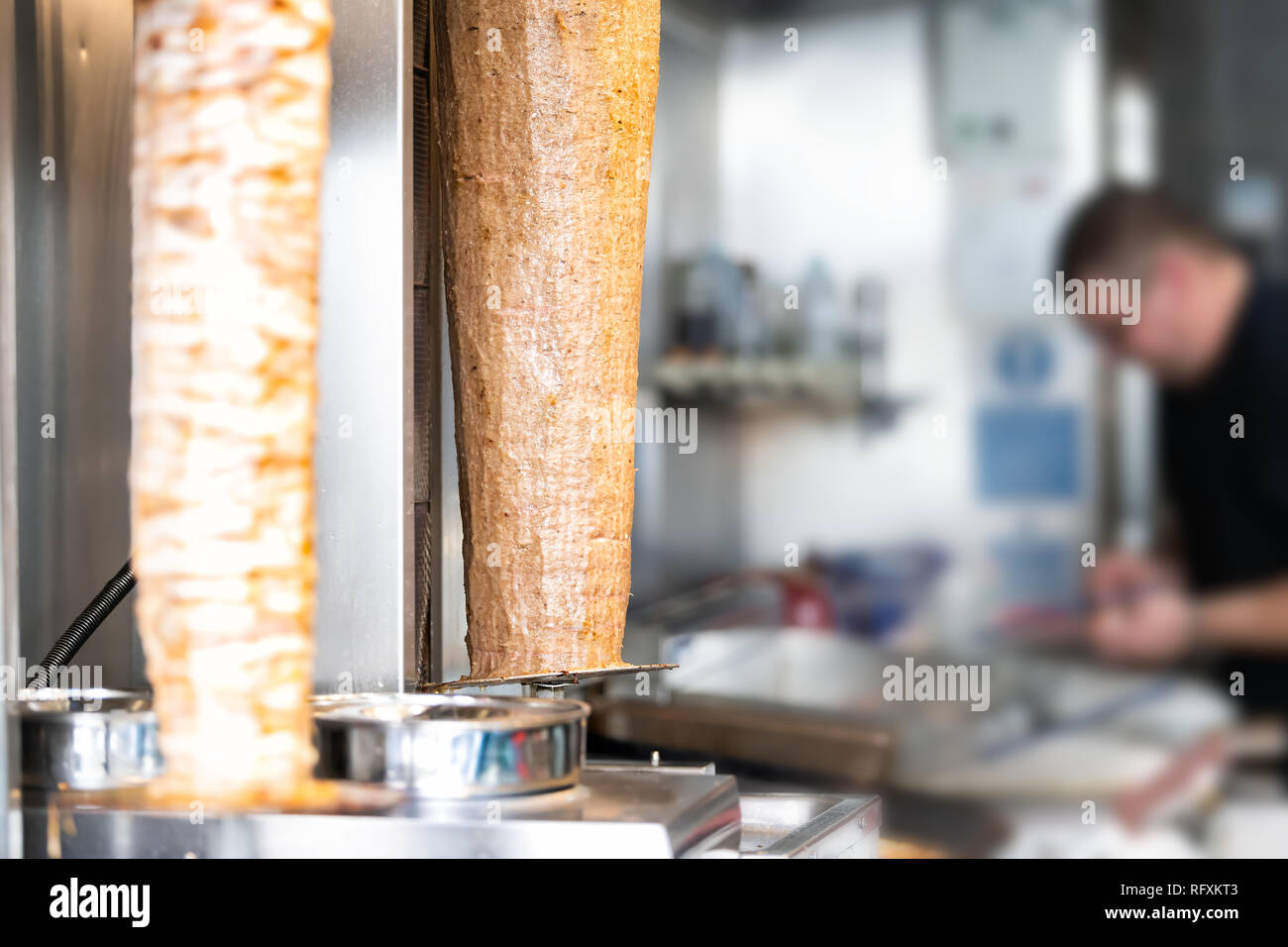 Meat carving grilled kebab closeup with chef in building restaurant