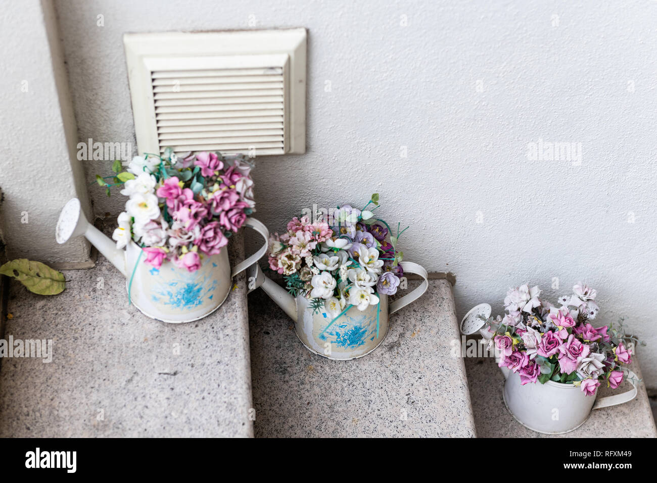 Closeup Of Decorative Flower Pots On Steps To Flat House In London