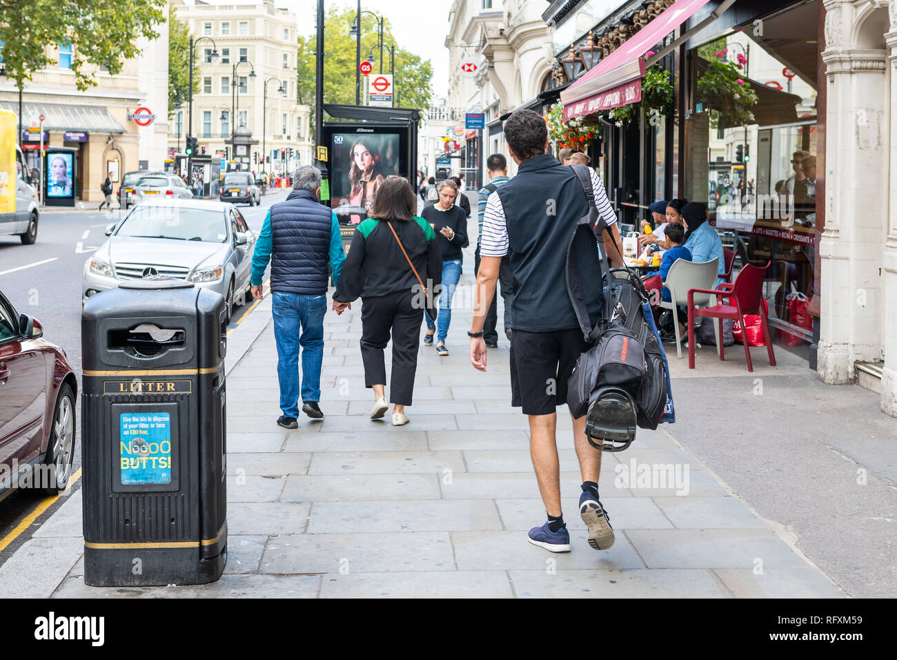 London, UK - September 16, 2018: Neighborhood district of Kensington street and road with shopping stores and people walking on sidewalk pavement by c Stock Photo