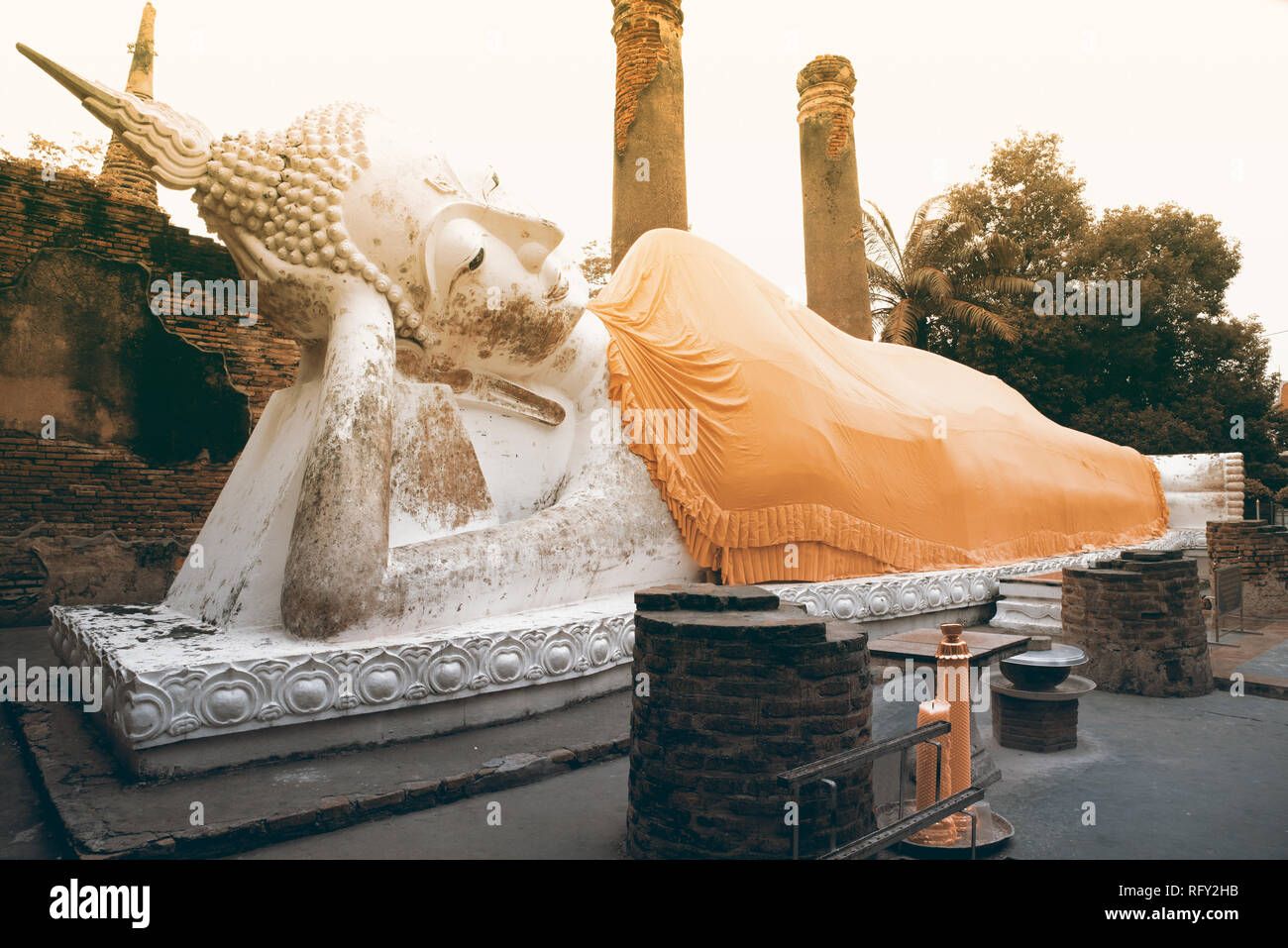 Reclining Buddha statues and ruined at Principal Chedi in Wat Yai Chai Mongkhon the Great Monastery of Auspicious Victory is located Ayutthaya. Stock Photo