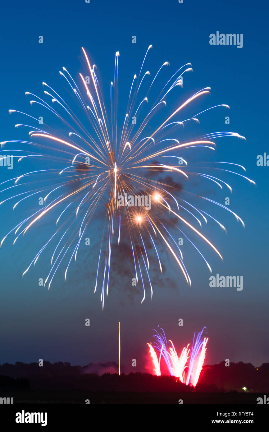 Fourth of July fireworks over small town America. Peru, Illinois, USA