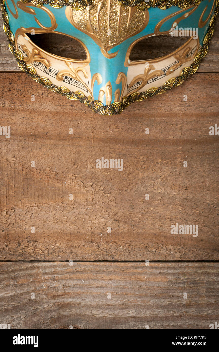Decorated Venetian Mask For Mardi Gras On Wooden Table Stock Photo