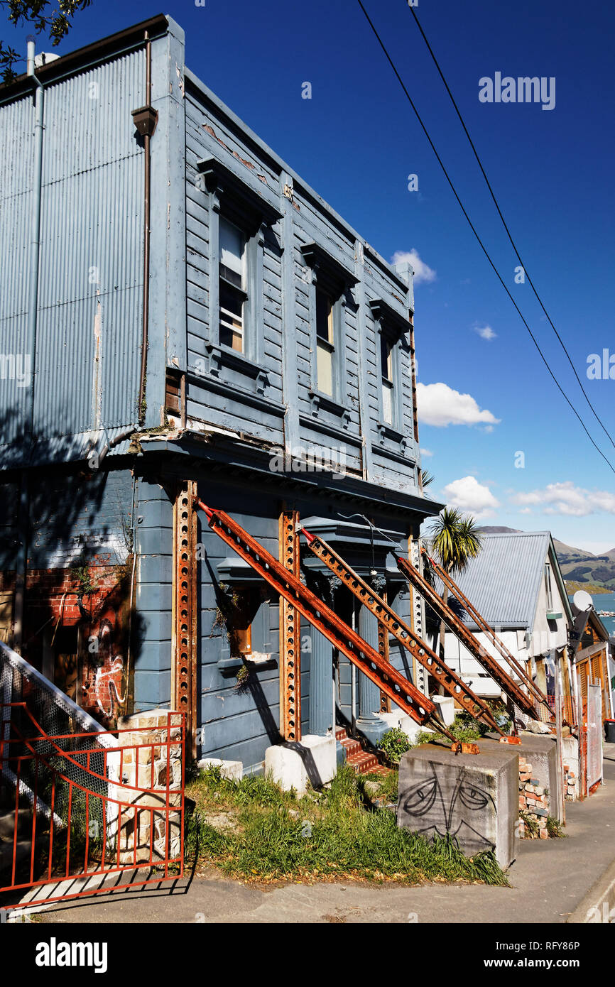 Earthquake damaged building being propped up, Lyttelton, Christchurch, New Zealand. Stock Photo