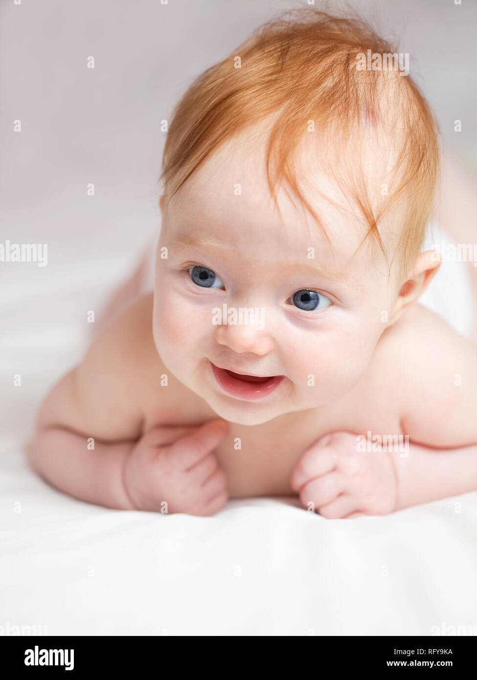 Cute ginger hair baby with blue eyes Stock Photo - Alamy