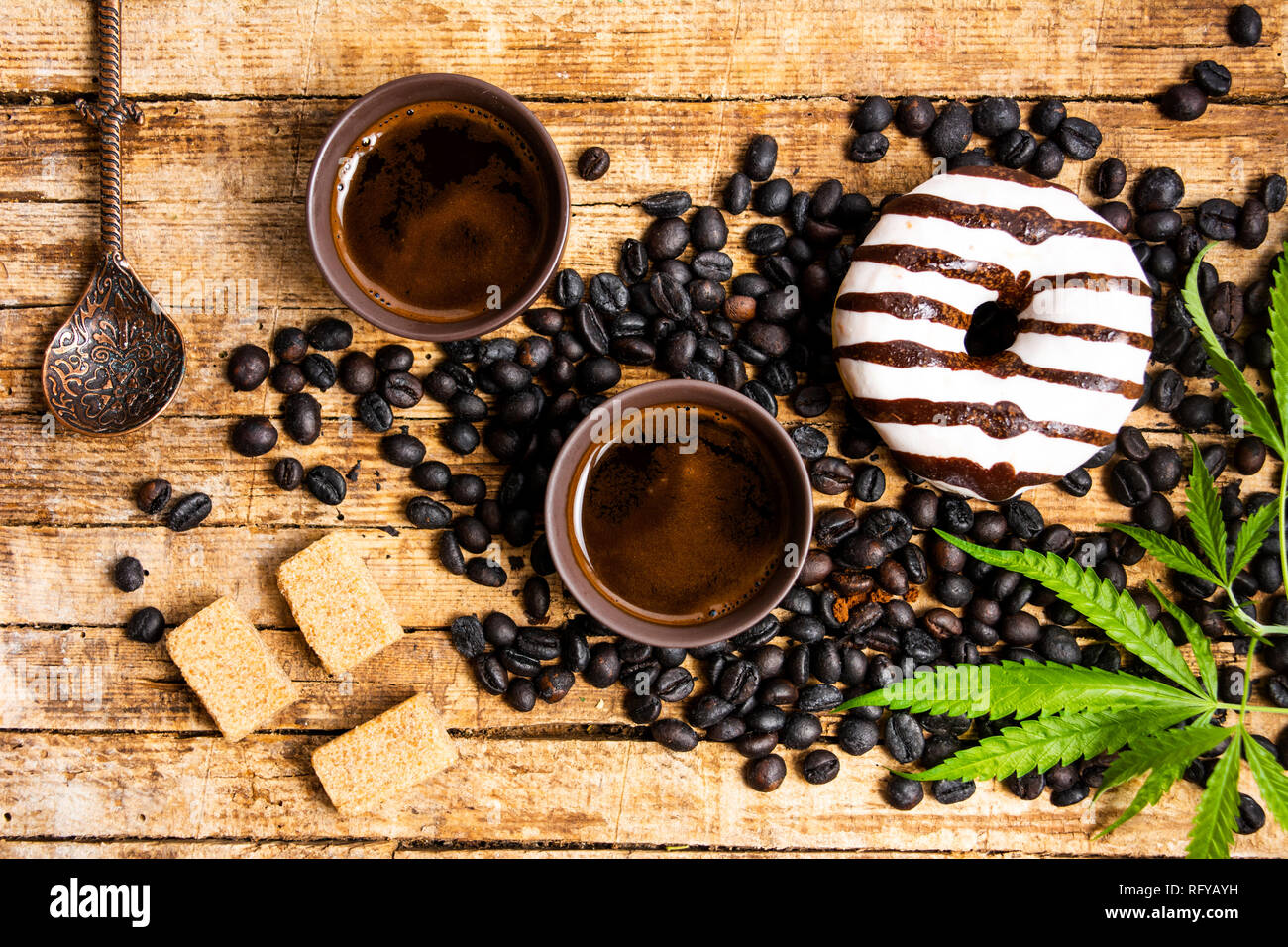 Coffee beans with marijuana plant tabletop view Stock Photo Alamy
