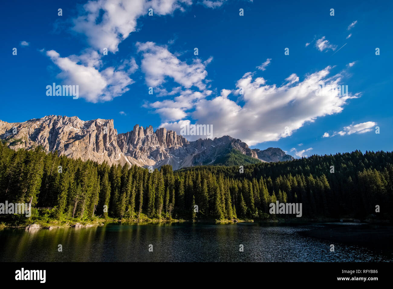 The Latemar mountain, mirroring in the lake Karersee, Lago di Carezza Stock Photo