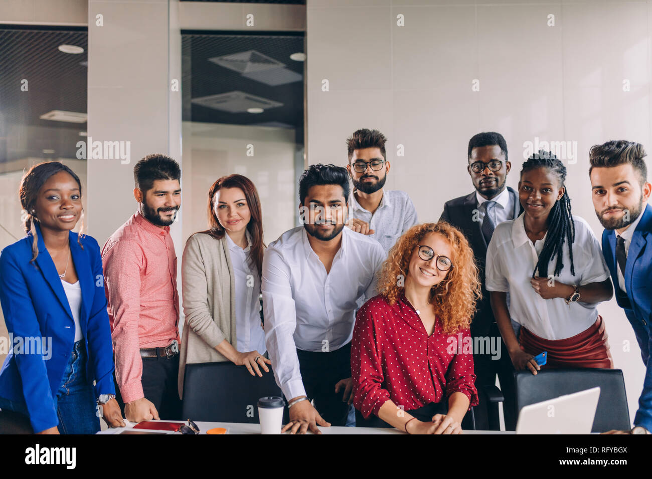 young and successful mixed race business people looking at camera Stock ...