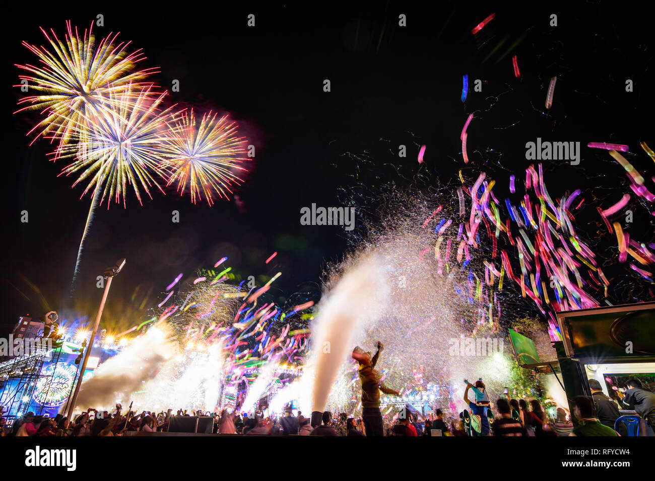 Crowd watching balloons ,fireworks and celebrating new year eve