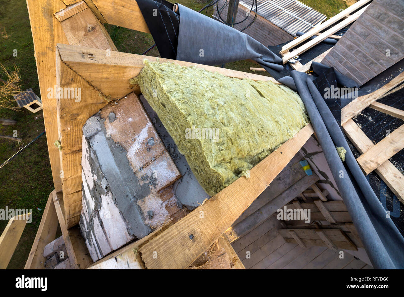 Roof construction and insulation with mineral wool. Wooden beams frame
