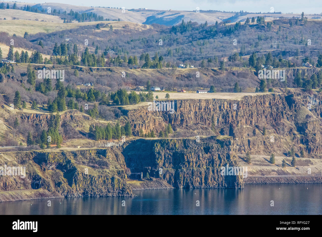 Columbia River basalt cliffs and rock slides. Located on Washington State side of Columbia River viewed from Oregon side of river Stock Photo Alamy