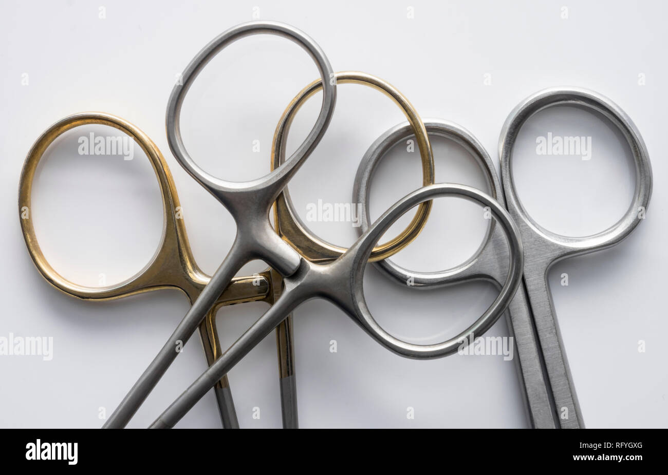 Various metal scissors isolated on white background, conceptual image Stock Photo