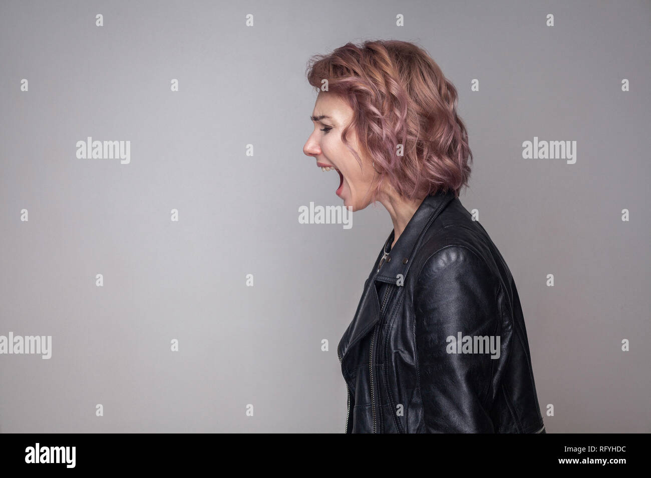 Profile Side View Portrait Of Angry Girl With Short Hairstyle And