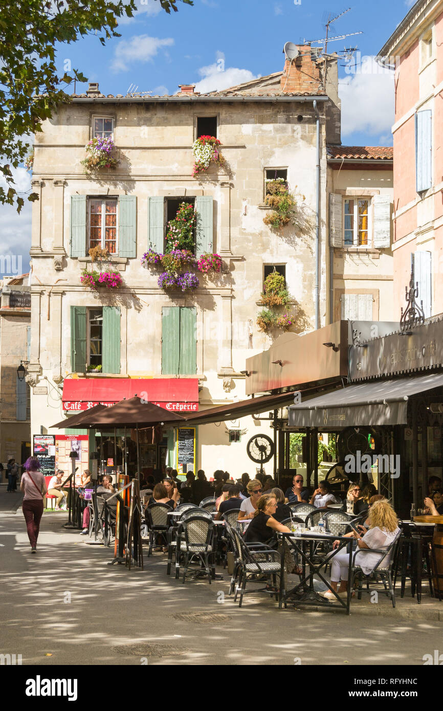 Arles, France - September 4, 2017: Locals and tourists spending time at the Place du Forum with its Cafés and Bistros. Stock Photo