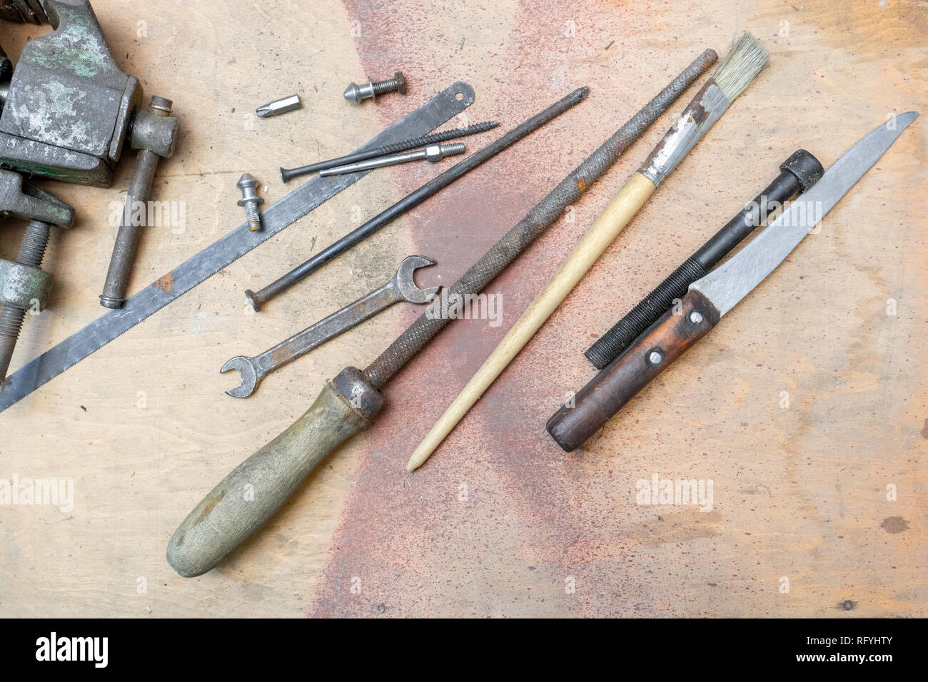 old working tools on painted wooden rustic background. Stock Photo