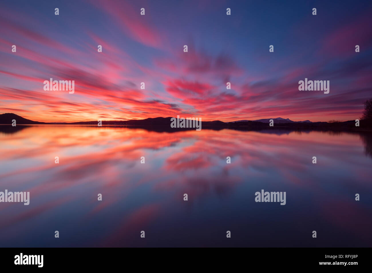 Colorful sunset reflected in a lake at Vitoria, Spain Stock Photo