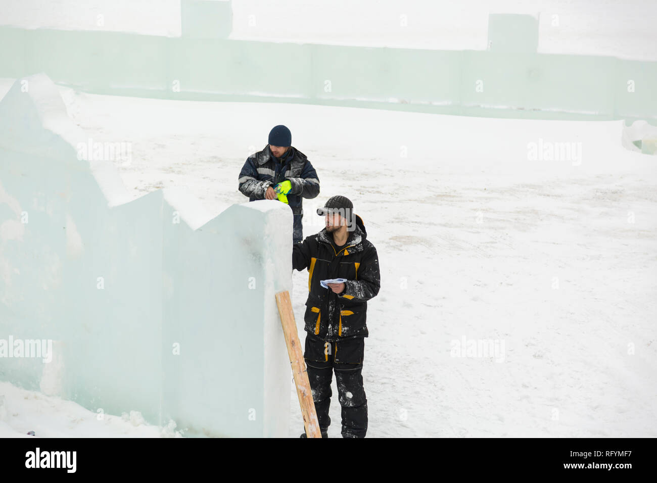 The artist draws the contours of the future ice figure on the ice Stock