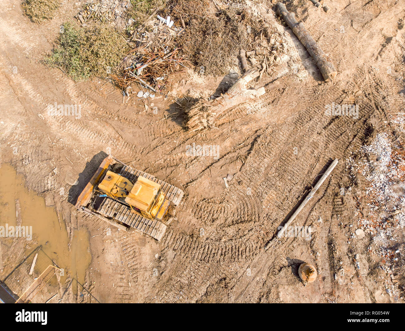 bulldozer working at old building demolition site. aerial top view Stock Photo