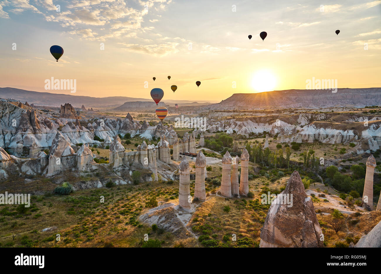 Ballons and uniqe rocks of Cappadocia. An ordinary morning in Cappadoica Stock Photo