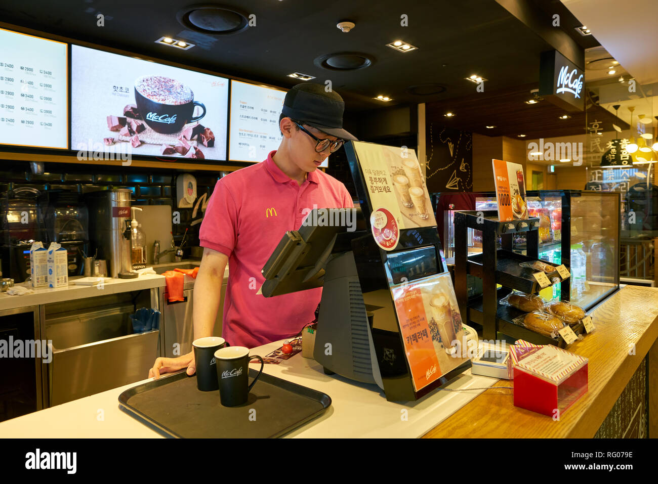 Mccafe Worker SEOUL, SOUTH KOREA - CIRCA MAY, 2017: worker at McCafe. McCafe is a ...