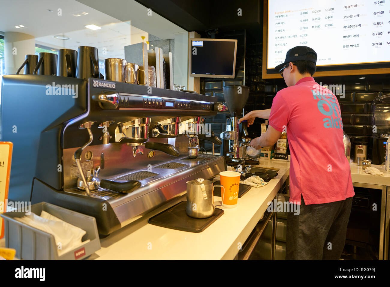 Mccafe Worker SEOUL, SOUTH KOREA - CIRCA MAY, 2017: barista at McCafe. McCafe is a ...