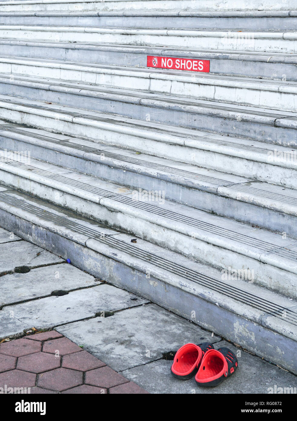 Red color No shoes sign on staircase Stock Photo