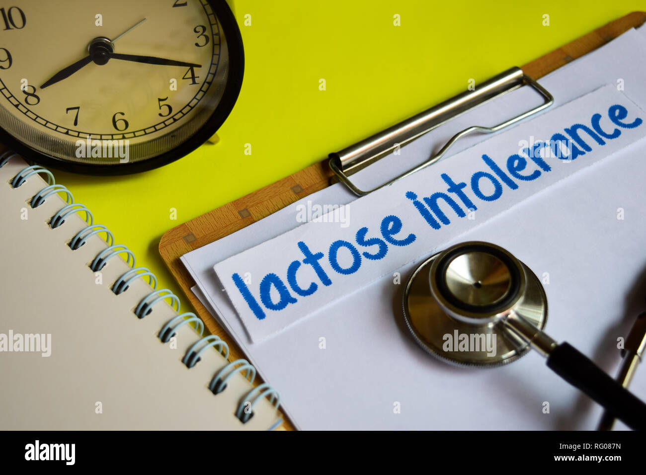 Lactose intolerance on healthcare concept on yellow background Stock