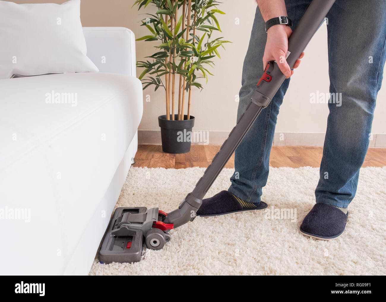 Using vacuum cleaner and cleaning the carpet Stock Photo Alamy