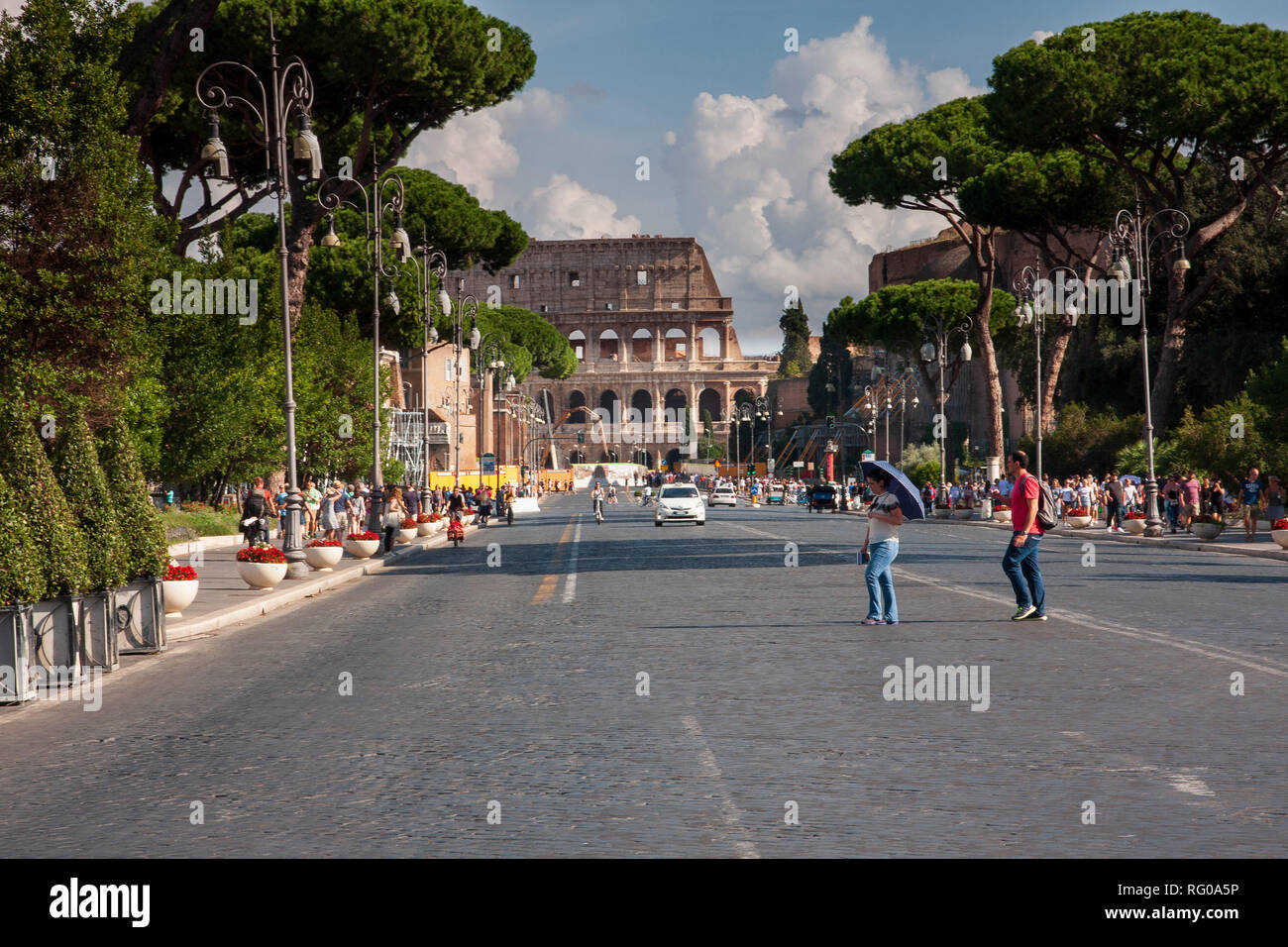 Roman road leading to Colosseum Stock Photo