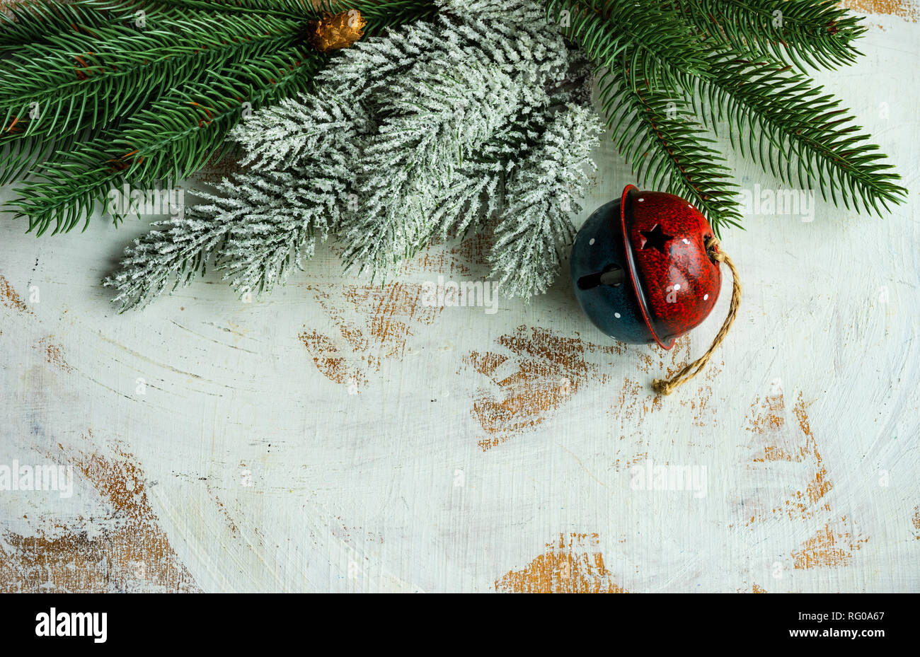 Christmas themed frame with fir tree branches and holiday decoration on ...