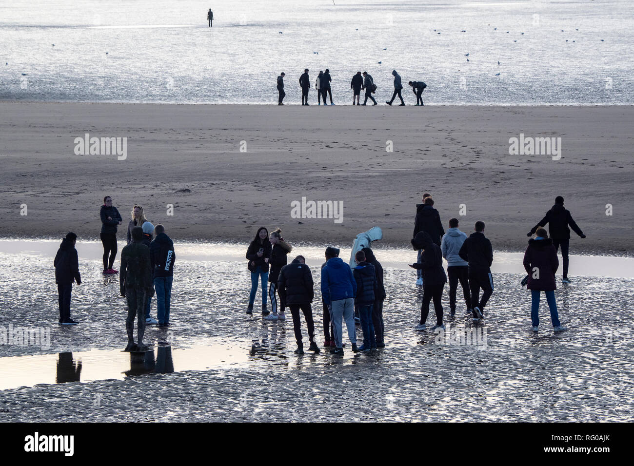 School Children visiting the Antony Gormley Iron Men in the Sea
