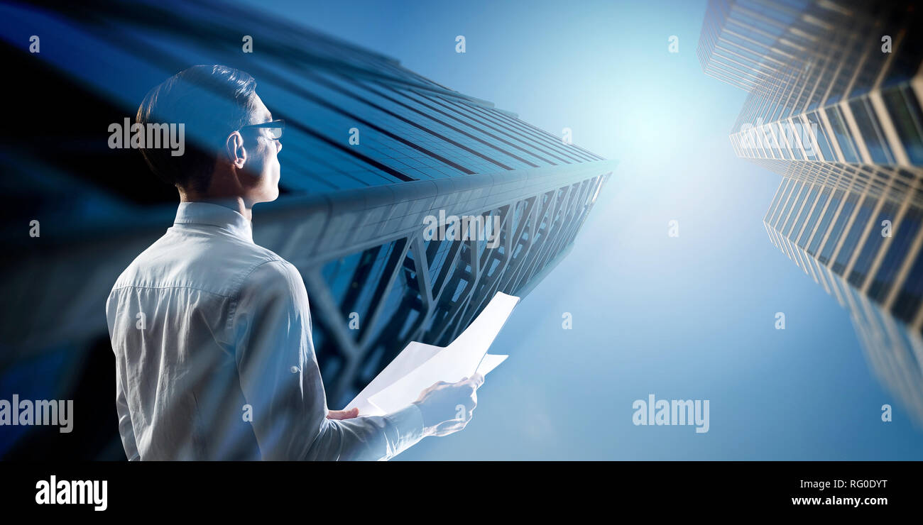 Double exposure of pensive businessman and modern city Stock Photo - Alamy