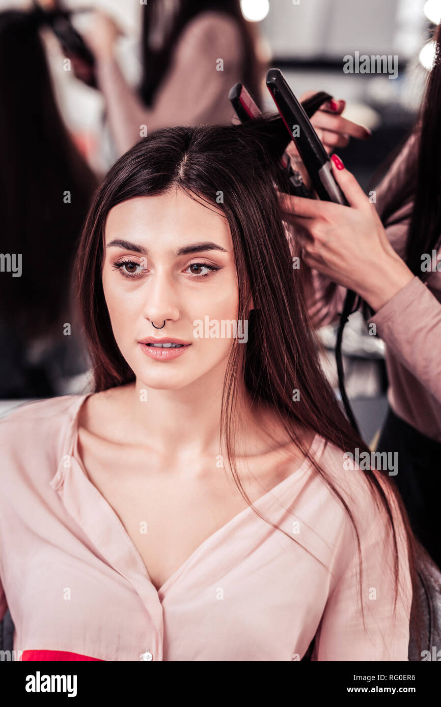 Beautiful long haired woman being in the beauty salon Stock Photo