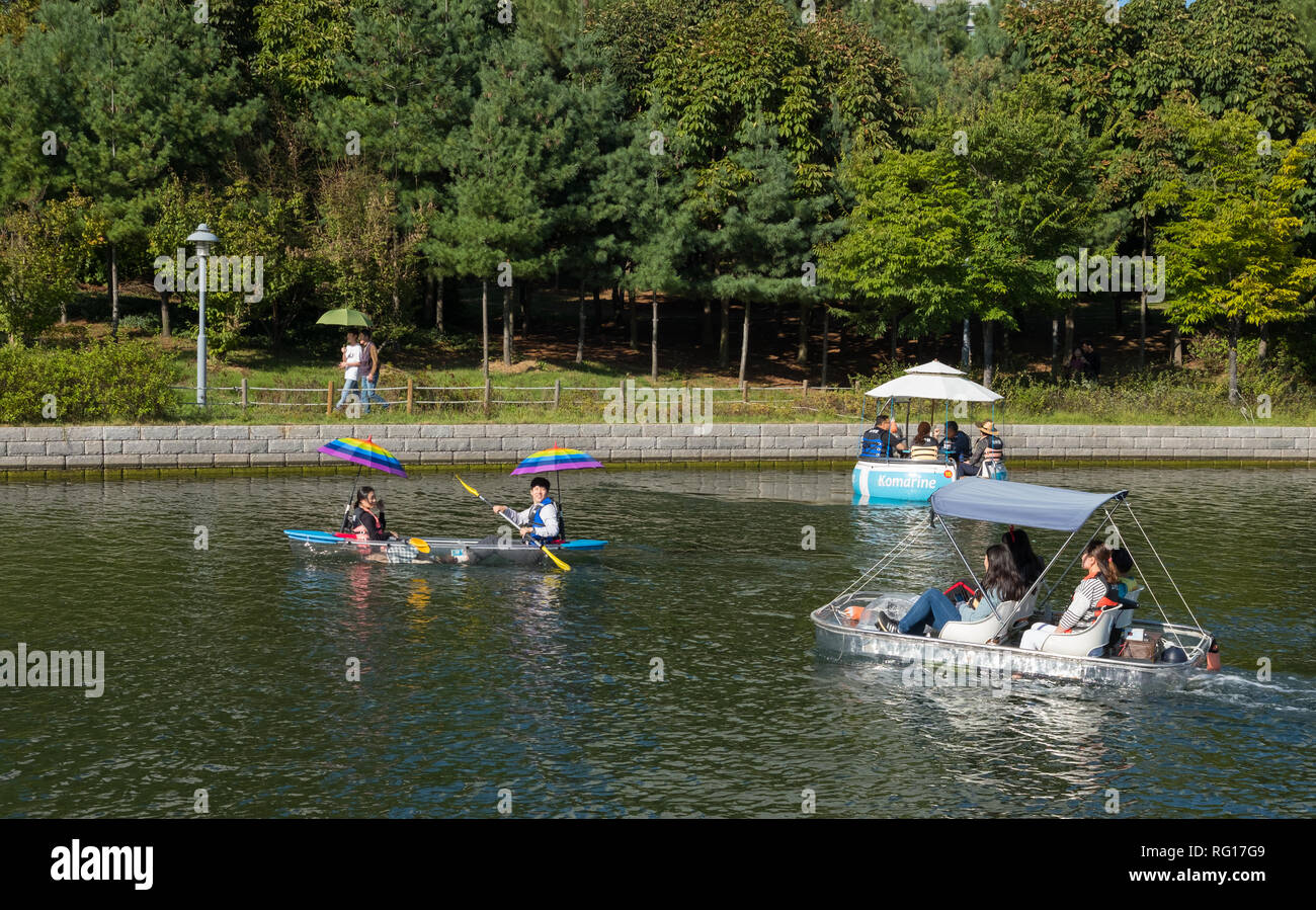 People renting canoes, boats, pedalos on Songdo Central Park, Songdo