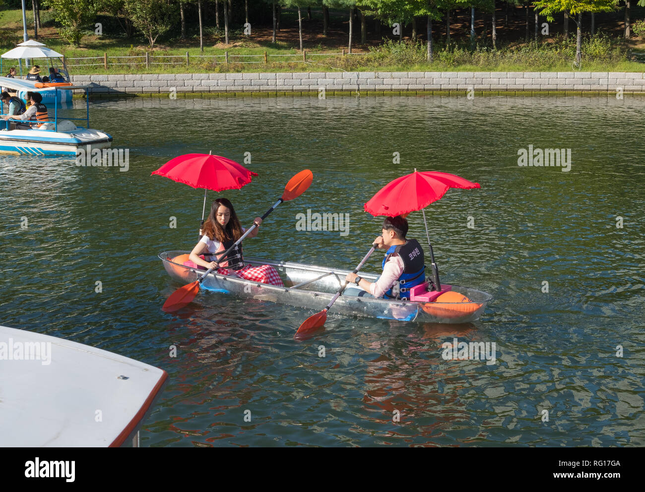 People renting canoes, boats on Songdo Central Park, Songdodong