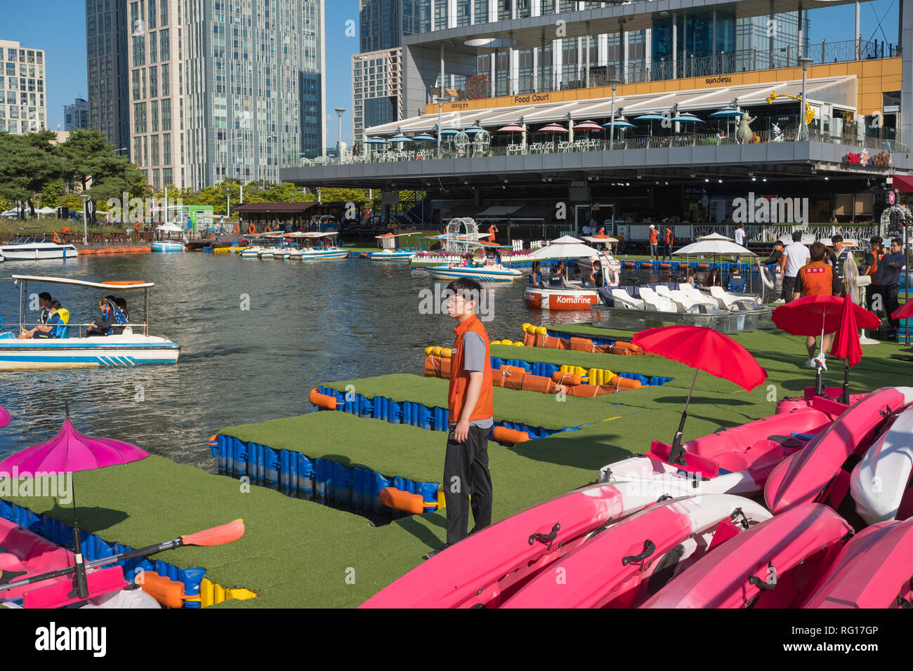 People renting boats, pedalos, canoes at Songdo Central Park, Songdo