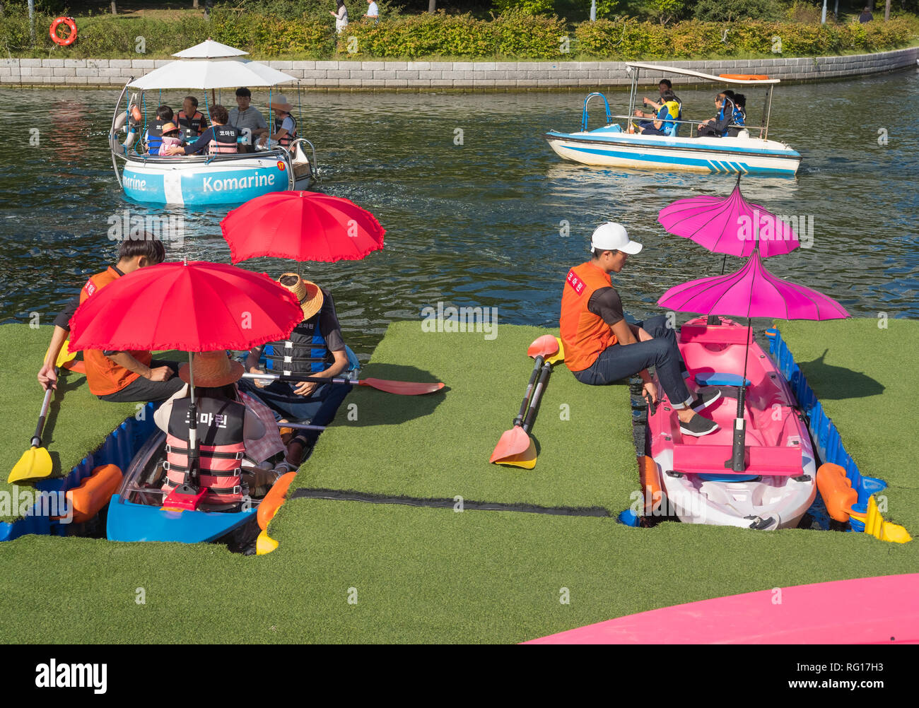 People renting boats, pedalos, canoes at Songdo Central Park, Songdo