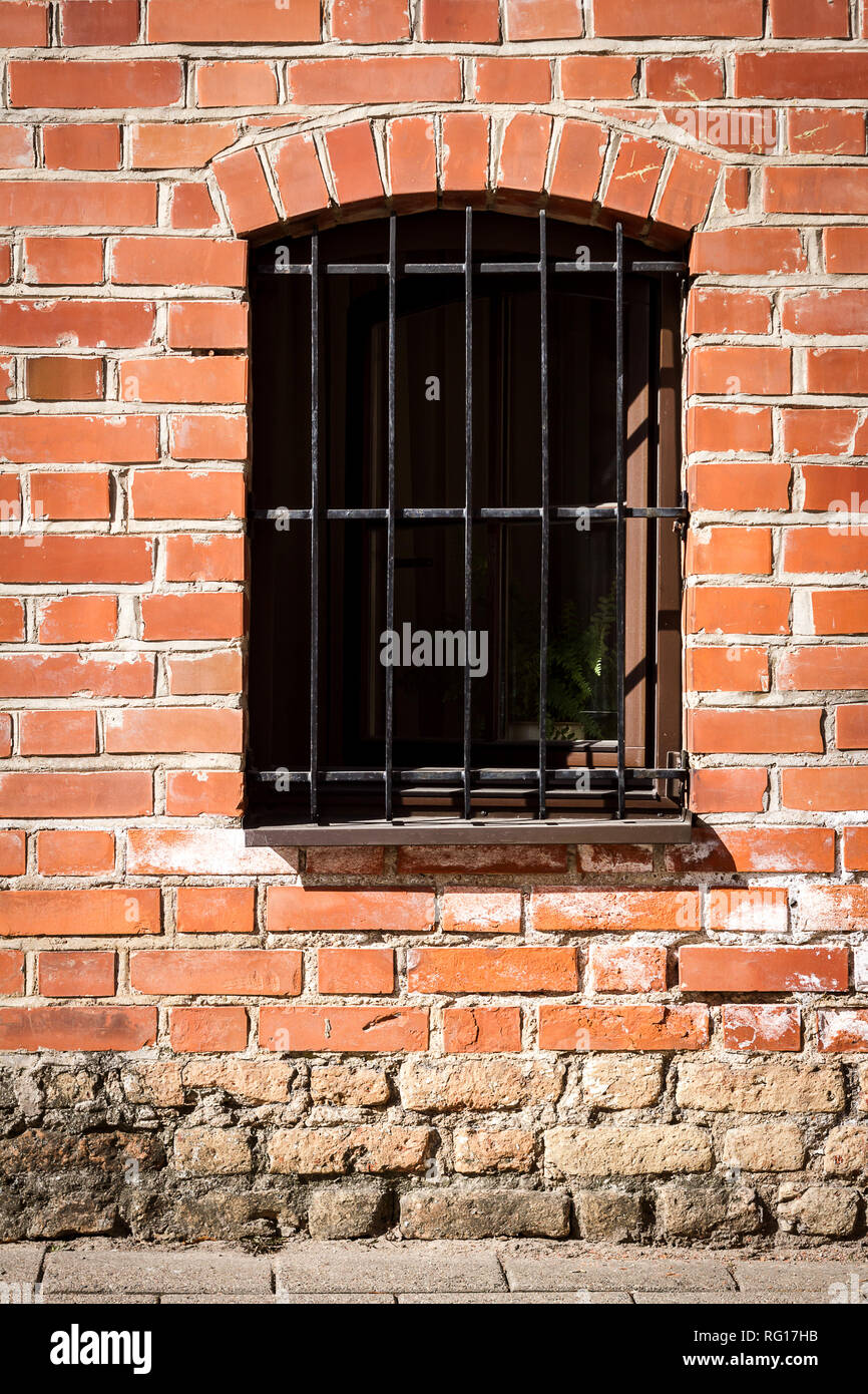 Red brick wall with a window Stock Photo - Alamy