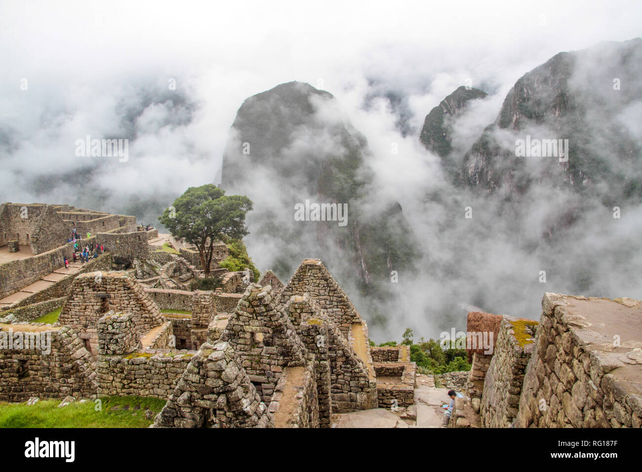 Panoramic view of Machu Picchu, the world famous ancient inca city, hidden in the cloud forest mountains of Peru in South america Stock Photo